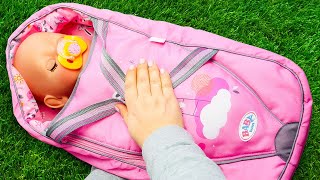 Download lagu Feeding the baby doll with toy food before going for a walk with a baby bottle. mp3 Download lagu Feeding the baby doll with toy food before going for a walk with a baby bottle. mp3
