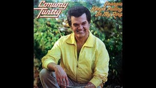 Georgia Keeps Pulling On My Ring by Conway Twitty from his album 20 Greatest Hits