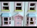 Setting up American Girl Doll House with furniture.