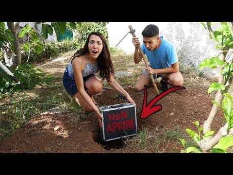 WE FIND A MYSTERY SUITCASE BURIED IN OUR GARDEN!