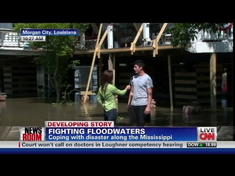 Homeowners surrounded by floodwater