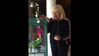 Parrot sings along with Sylvia Bennett