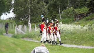 Soldiers from the 18th century shoot into the air