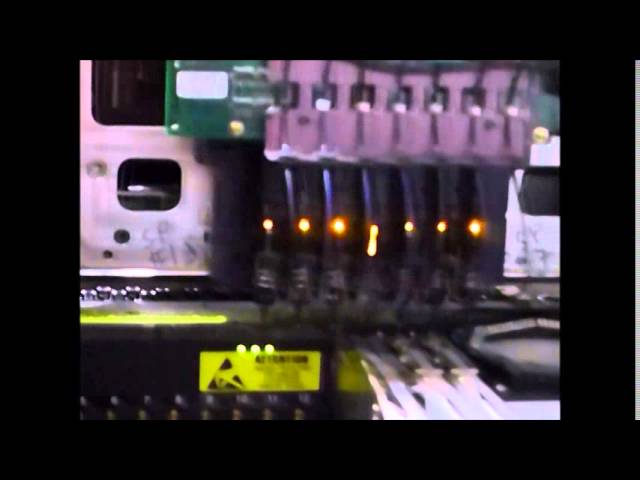 Universal GX-11S (4992B) placing components (0402, 0603, 0805, SOIC24, and QFP80) onto a pcb. The machine runs twice, once with automatic z update (azu) and once in full speed.