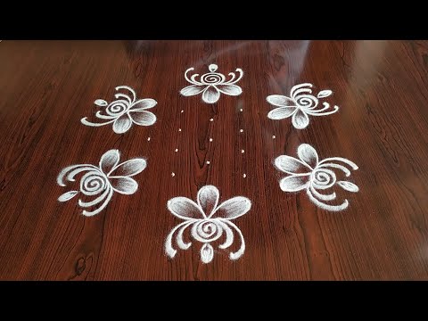flower kolam rangoli design 7*4 dots by simple and easy rangoli