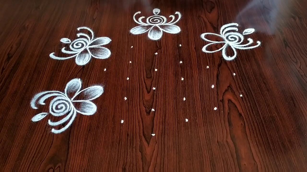 flower kolam rangoli design 7*4 dots by simple and easy rangoli