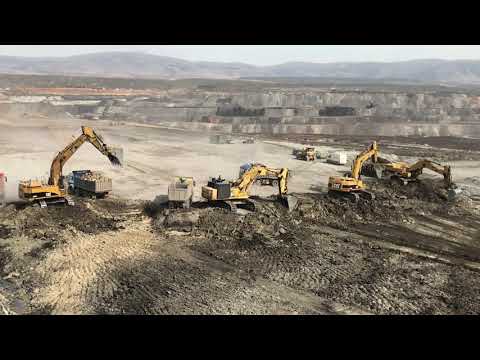 Caterpillar 365C Excavators And Komatsu PC800 Excavator Loading Trucks