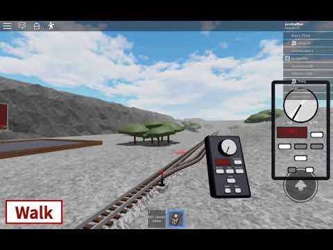 A Dash840B Santa Fe train passing a railroad crossing in Redrock County