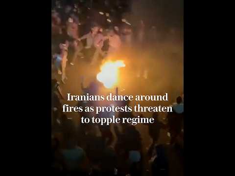 Iranian protesters dance around fires as Tehran protests threaten to topple regime