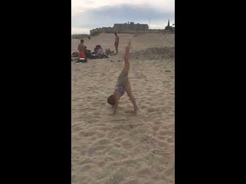 JeanMarie doing gymnastics on a beach.            NO WAY!! Lol