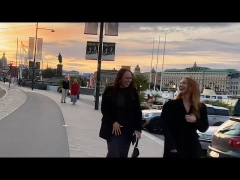 Stockholm Walks: Old Town at sunset. Summer evening stroll along shoreline and historic alleyways