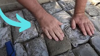 The brilliant reason he lays ziploc bags of cement in his backyard