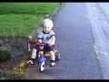 Baden Blankenship riding his tricycle