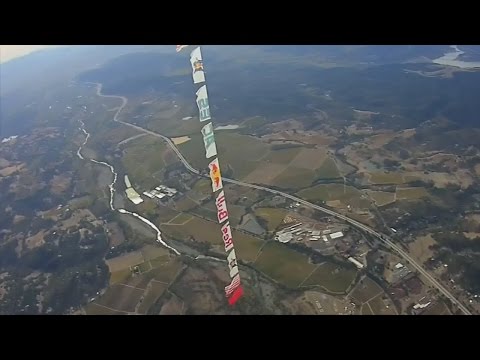 Wingsuit flyers race through slalom course