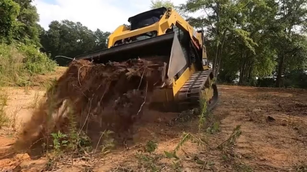 BACKFILLING A BORROW PIT WITH MY CAT 259D SKID STEER!