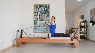 Rotação e Flexão de Tronco com Fortalecimento de Braço Sentado no Reformer