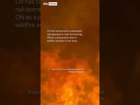 Train engulfed by wall of flames in Canada wildfire