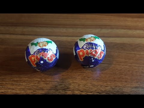 unwrapping a cadbury Christmas pudding
