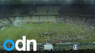 Police fire percussion grenades as fans riot in Brazil's World Cup stadiums
