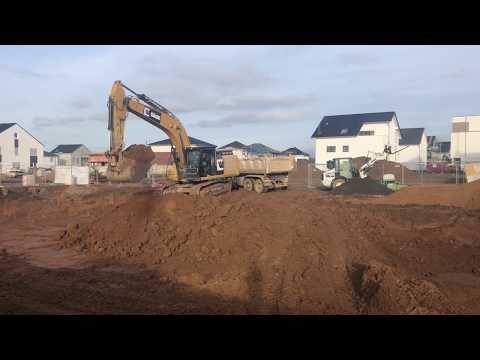 Caterpillar 336F loading Trucks