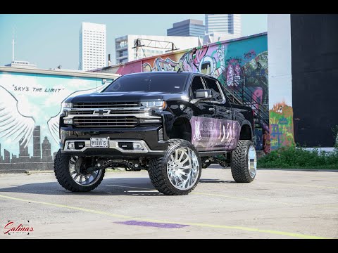 2019 Chevrolet Silverado on 10 inch lift with 26x14 Advertises Custom Boot shop in Houston Texas!