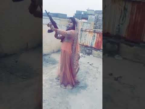 Girl firing in Ak47