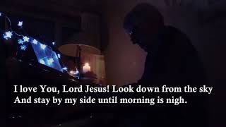 Away in a manger Carol. Piano and voice with lyrics