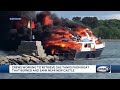 Crews work to retrieve gas tanks from burned boat near New Castle