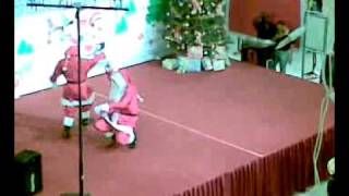 Two Santa Clauses Dancing