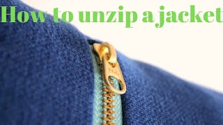 How to unzip a jacket and zip it up again.