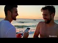 Gay Romantic Scene On The Beach With Sun Set