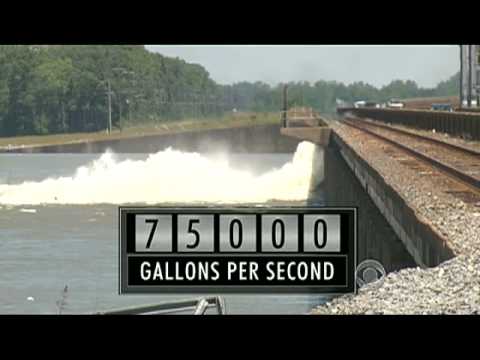River floodgates spare New Orleans, flood Cajun country