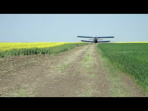 Antonov 2 - An2- YR-LAR-landing on a dirt road