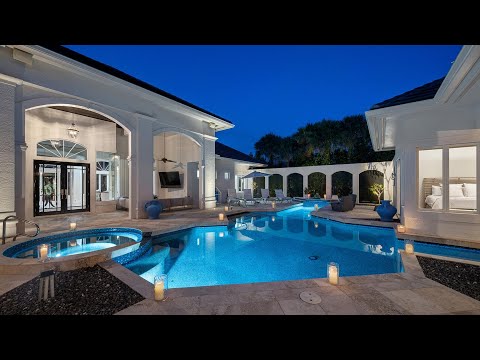 A $5,800,000 Elegant lake view home in Naples with ultimate privacy for entertaining