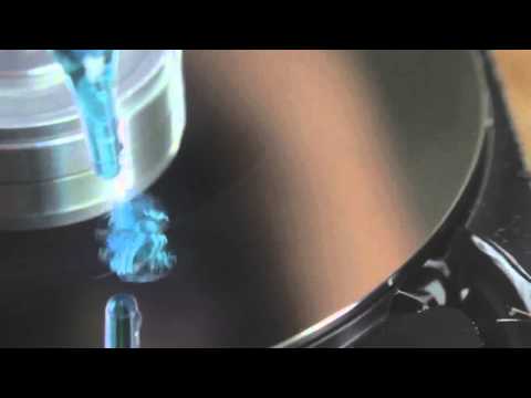 Pouring Water on a Hard Drive in Slow Motion