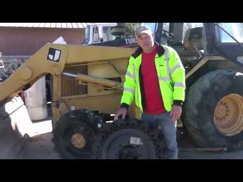 Mclaren Solid Cushion Tires on CAT backhoe