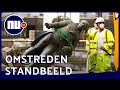 Omstreden standbeelden in Engeland en België verwijderd | NU.nl
