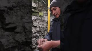 He heats the mercury to separate it from the gold, releasing deadly fumes.