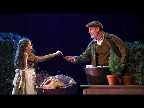 Trailer close-up: a key turning as chorus rises toward the final cadence