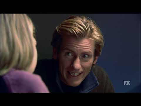 FX’s Rescue Me official series trailer still — Tommy Gavin framed by sirens and smoke