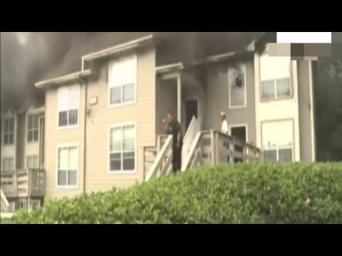 Incredible moment two girls jump to safety from blazing inferno into rescuers' arms