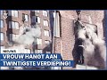 Dramatisch moment: vrouw bungelt aan flatgebouw