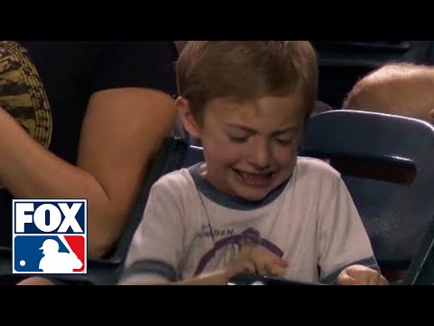 Kid struggles to crack peanut at Twins-Angels game