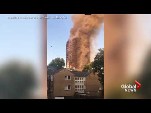 Distraught witnesses look on as massive blaze engulfs London apartment block