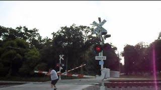 preview picture of video 'CSX Trains Crossing Gate Malfunctions Man Gets Hit On Head'