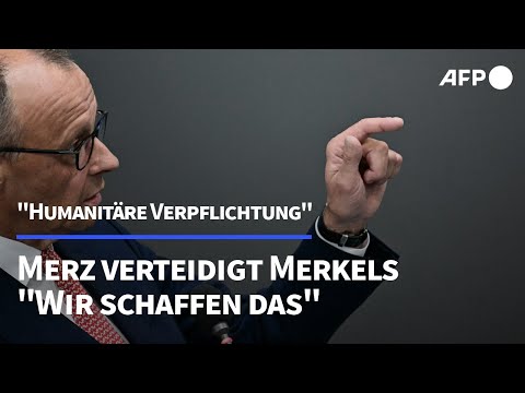Merz verteidigt Merkels Entscheidung zur Aufnahme von Geflüchteten | AFP
