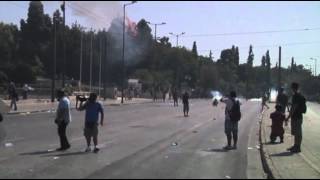 Raw: Athens Police Caught in Fires, Blasts