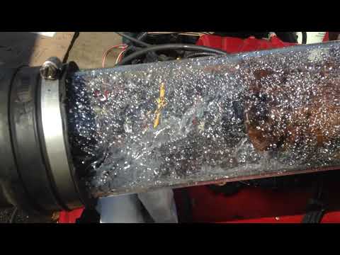 454 Mercruiser water reversion as seen thru clear 4\" tubes running outside boat