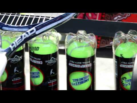 Tennis Tournament 05172014 70D BROLL CU racket by leg pan left to can of tennis balls & rackets