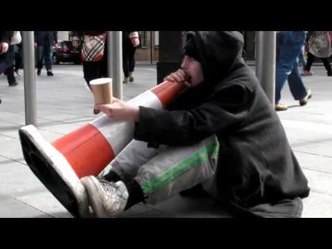 Street Musician Playing a Traffic Cone. London
